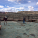 Volunteers from Utah Friends of Paleontology clean the track site in 2016.